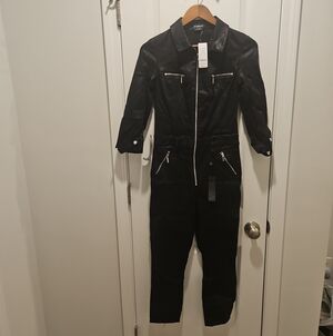 BEBE Black Zip-Front Jumpsuit with Silver Hardware